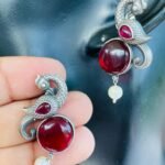 Silver Replica Peacock Earrings With Maroon Stone