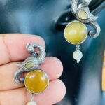 Silver Replica Peacock Earrings With Yellow Stone